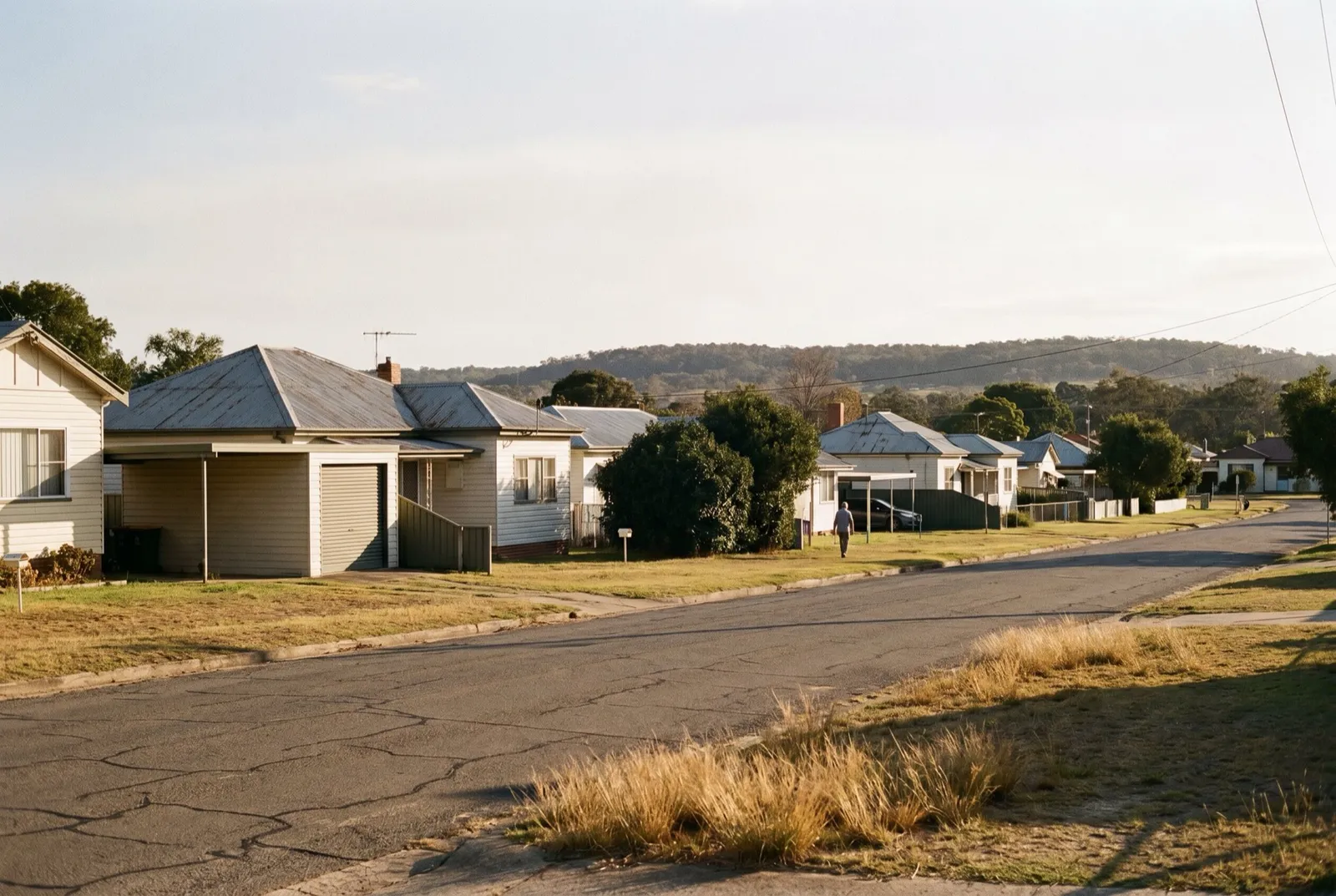 A quiet former mining township street of modest detached houses